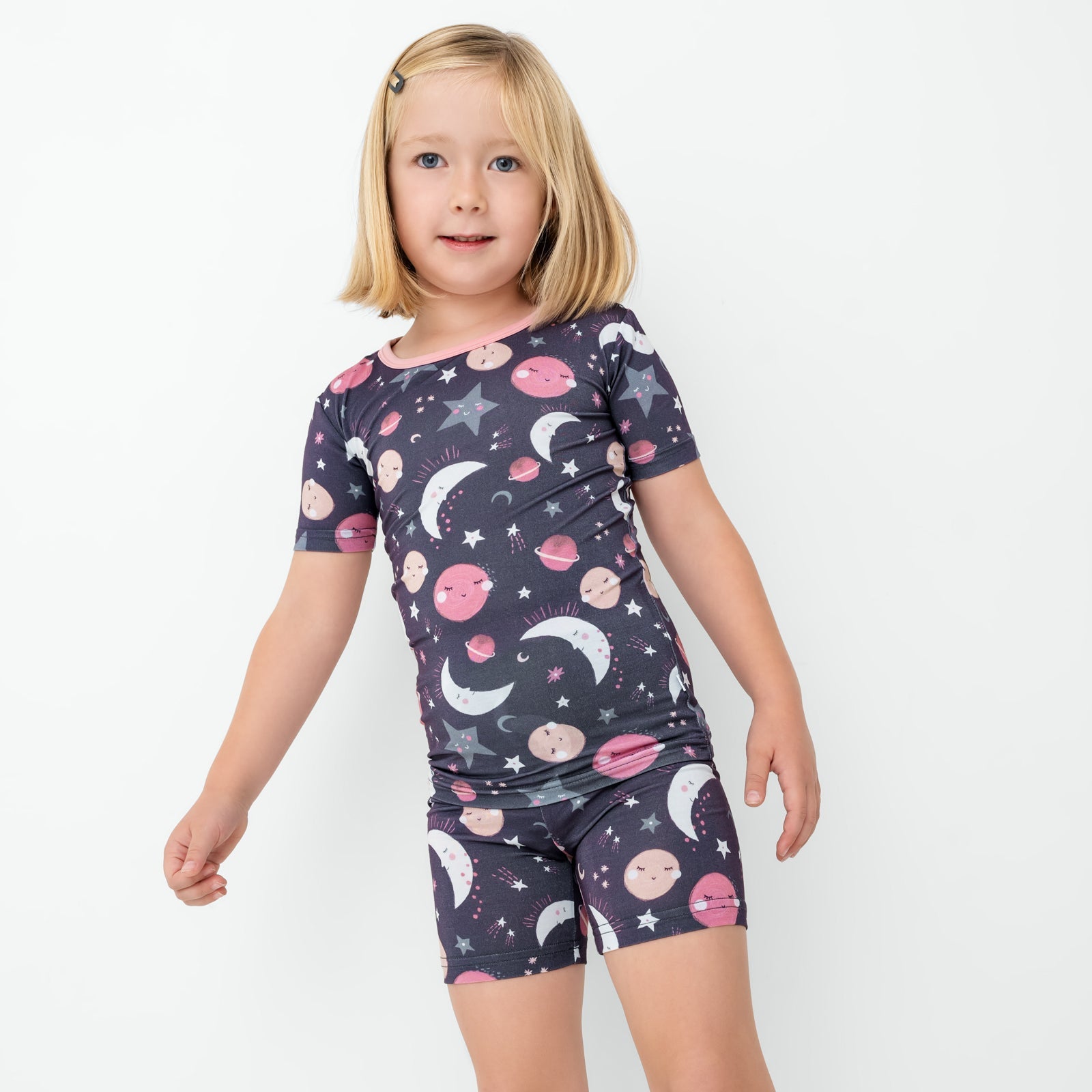 Girl wearing the Moonlit Galaxy bamboo short pajama set