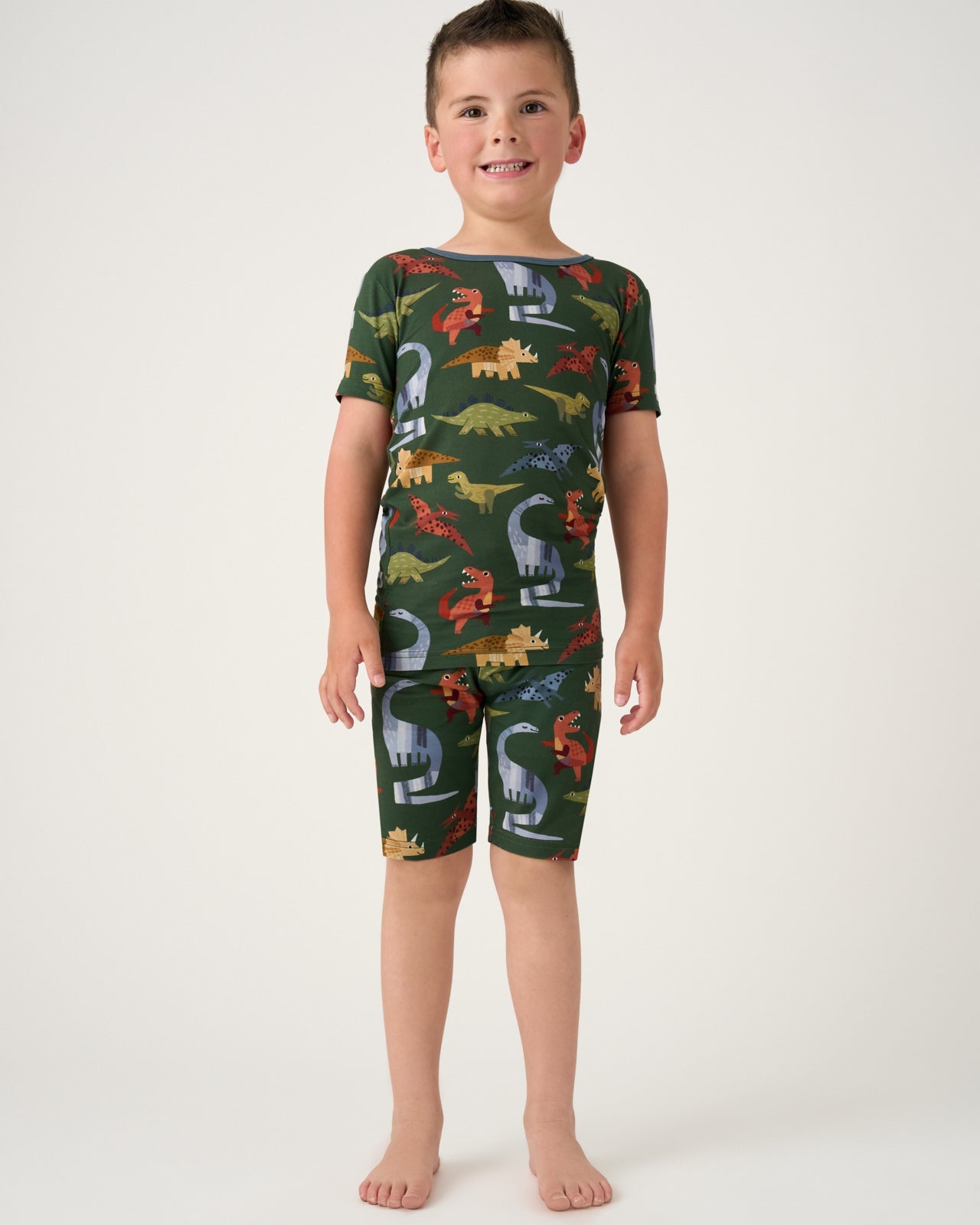 Boy wearing the Dino Forest bamboo short pajama set